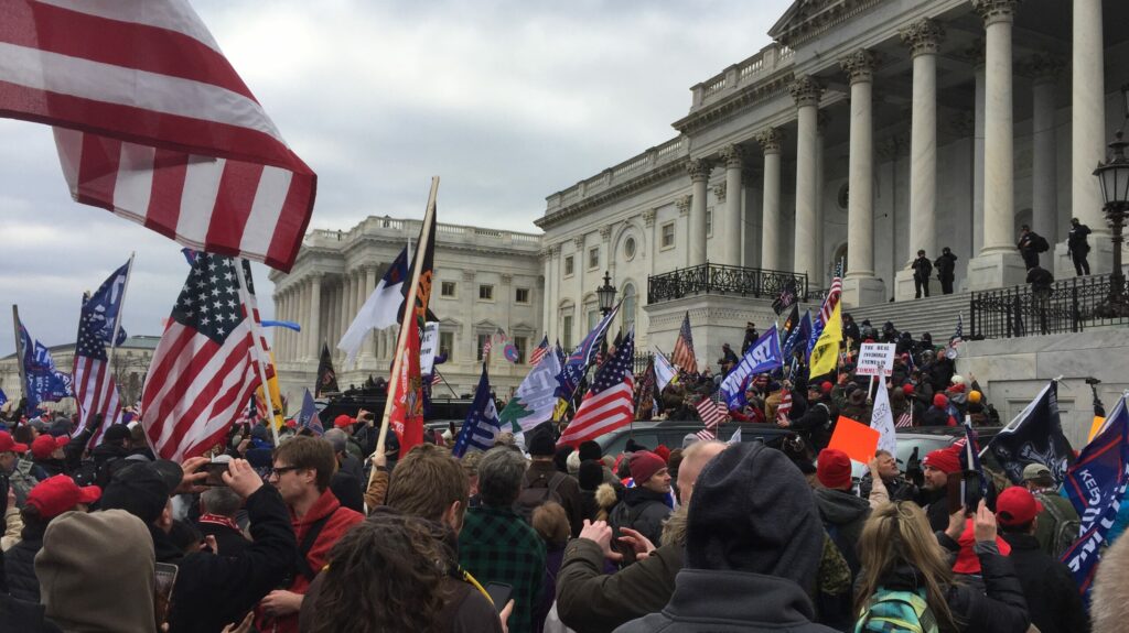 Is populism getting more popular: Crowd of Trump supporters marching on the US Capitol on 6 January 2021